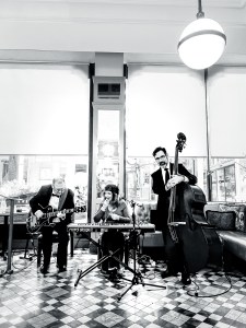 Black and white photo with 3 musicians